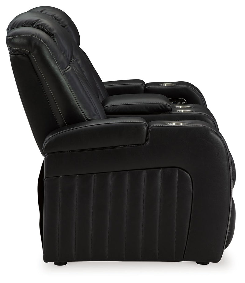 Caveman Den - Power Reclining Loveseat with Console/ Adj Hdrst - Midnight
